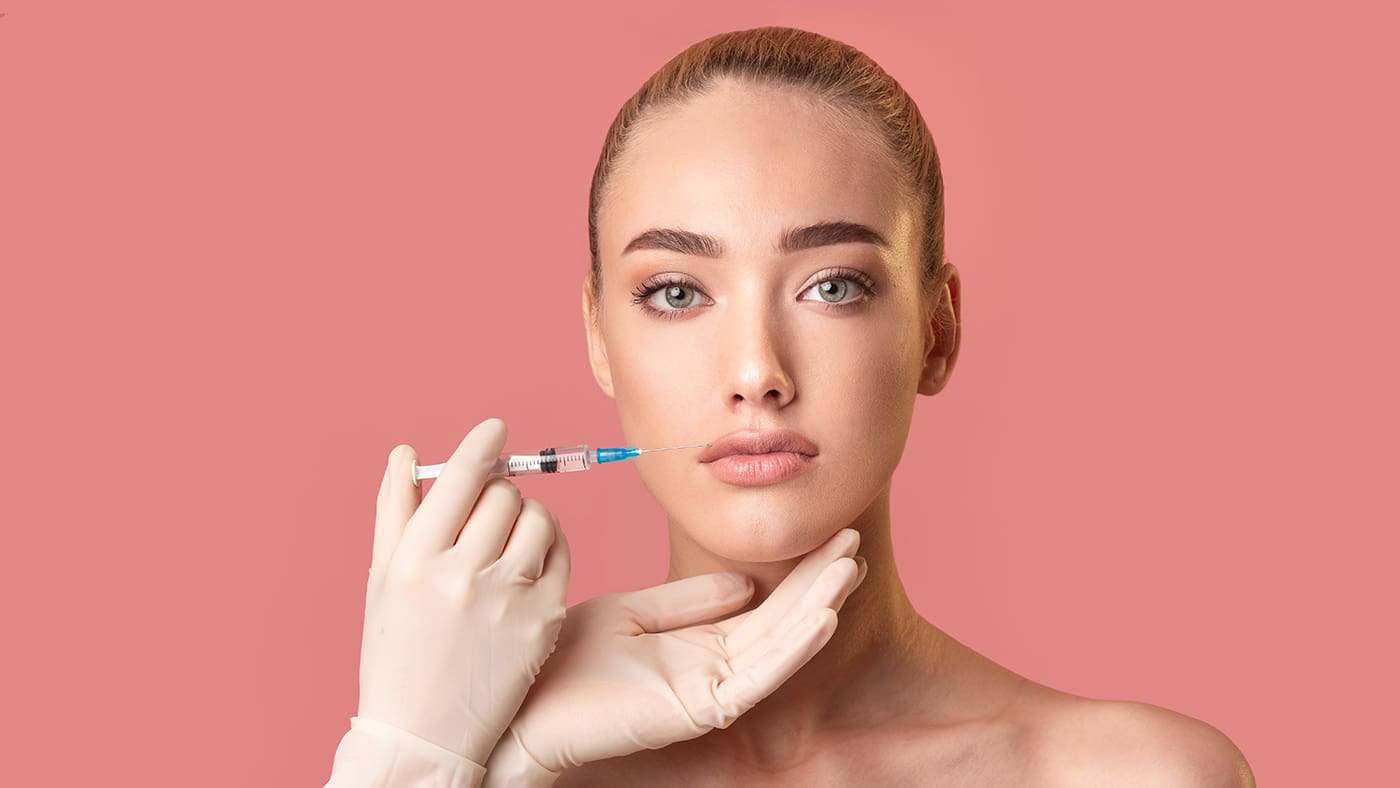 Woman receiving lip filler in London, Ontario