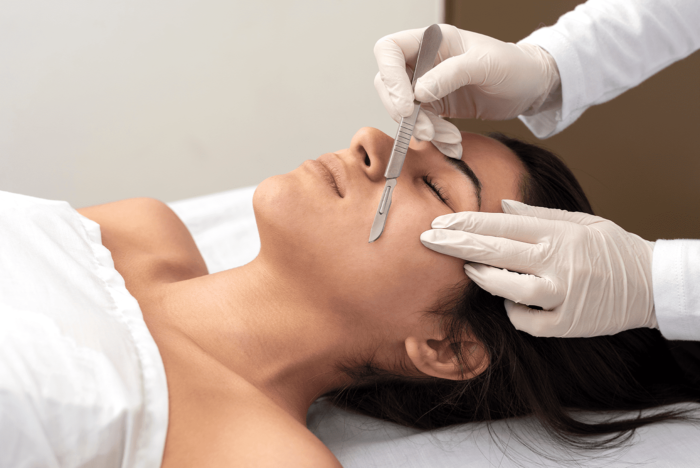 woman receiving a dermaplaning cosmetic treatment