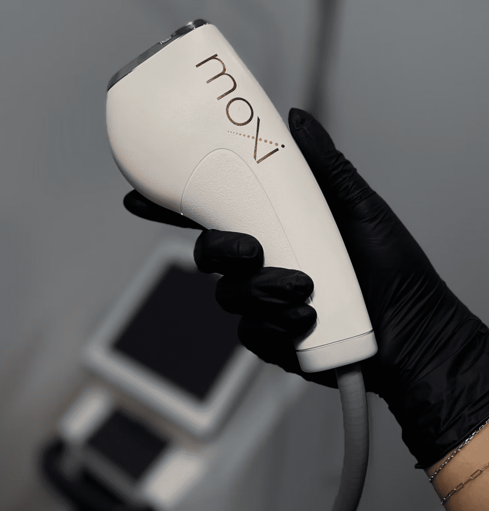 woman holding moxi laser machine