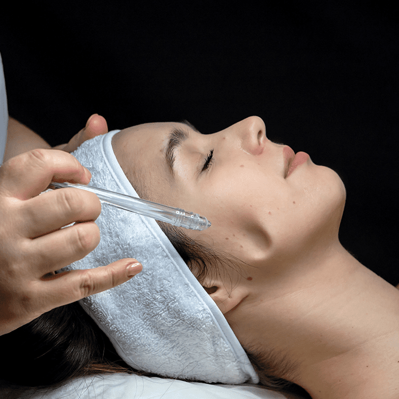 closeup of a jet peel facial being performed by belita savage